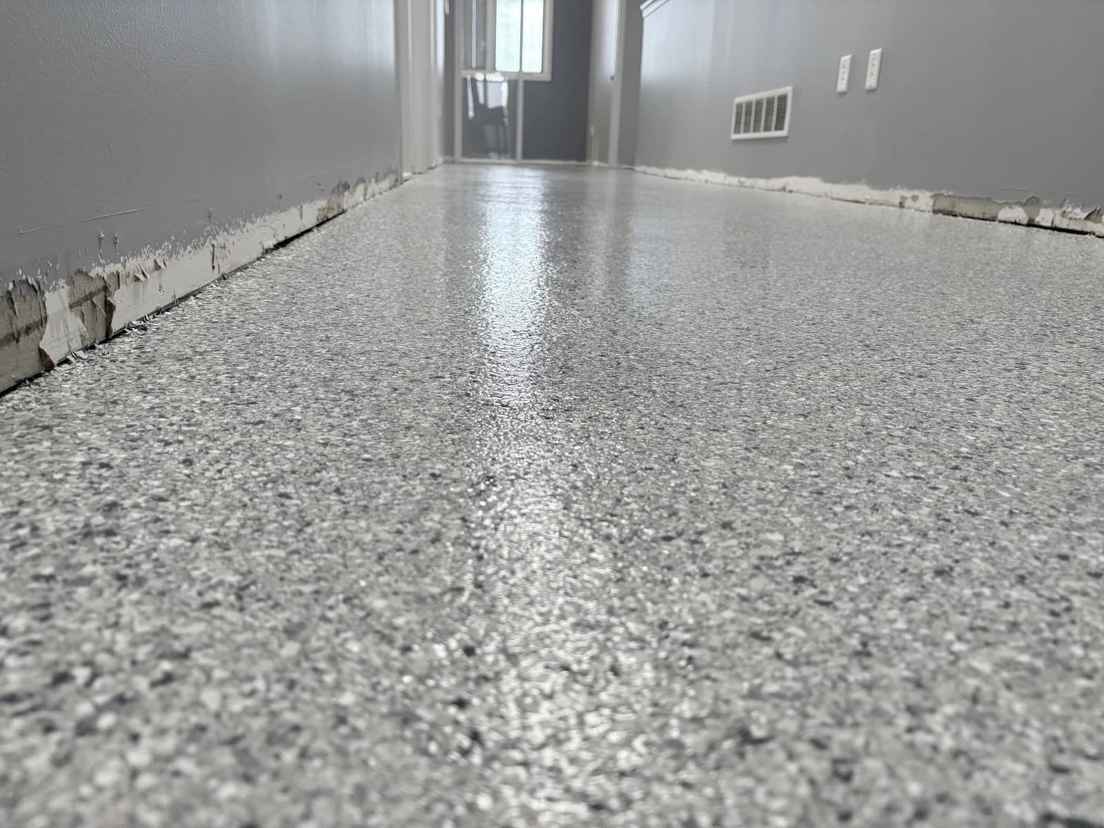 Light gray flake floor coating with a high-gloss finish