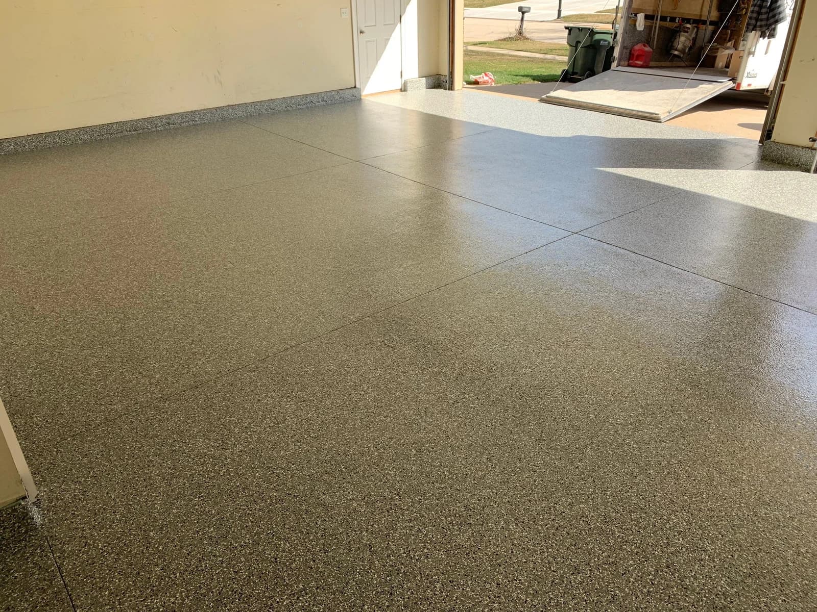 Garage floor finished with a warm tan flake concrete coating